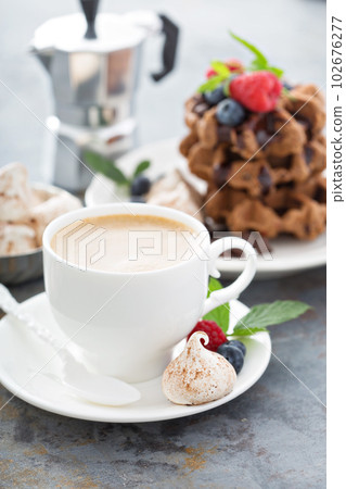 Cup of coffee for breakfast with waffles 102676277