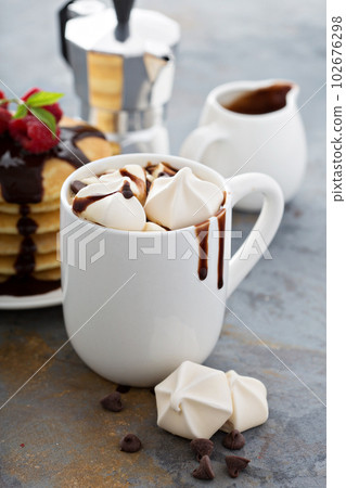 Hot chocolate with marshmallows and little meringues Hot chocolate with marshmallows and little meringues 102676298