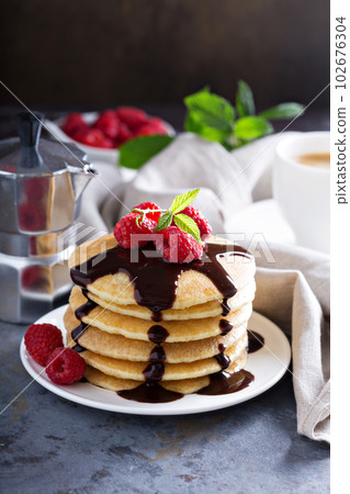 Stack of fluffy buttermilk pancakes 102676304