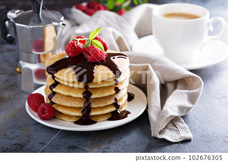 Stack of fluffy buttermilk pancakes 102676305