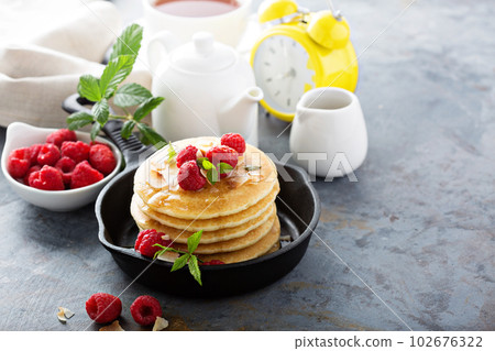 Stack of fluffy buttermilk pancakes 102676322