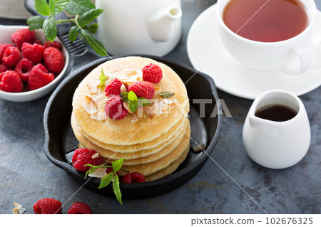 Stack of fluffy buttermilk pancakes 102676325