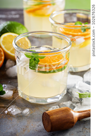 Refreshing summer cocktail with citrus fruits Refreshing summer cocktail with citrus fruits 102676326