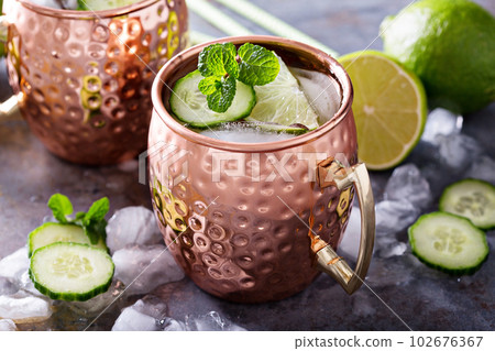 Moscow mule cocktail with lime and cucumber 102676367