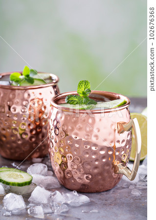 Moscow mule cocktail with lime and cucumber 102676368