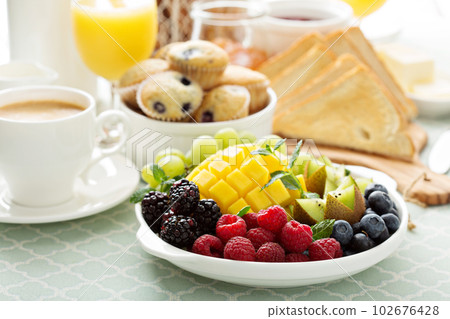 Fresh and bright continental breakfast table Fresh and bright continental breakfast table 102676428