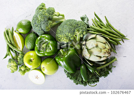 Variety of green vegetables and fruits Variety of green vegetables and fruits 102676467