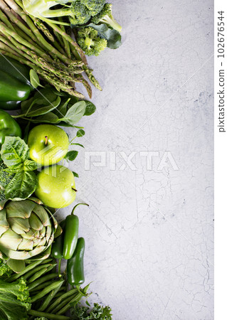 Variety of green vegetables and fruits 102676544