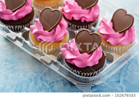 Romantic cupcakes with pink frosting 102676583