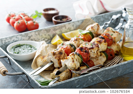 Chicken kabobs on a tray 102676584