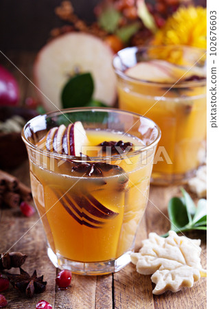Warm apple cider with spices Warm apple cider with spices 102676603