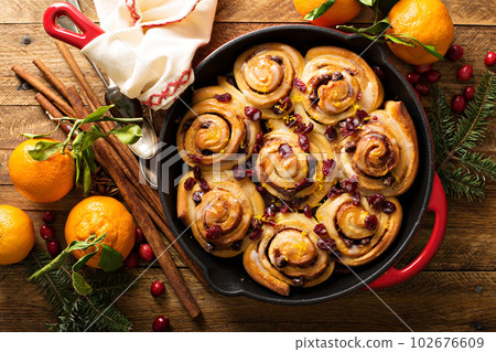 Cinnabon buns with cranberry and orange glaze 102676609