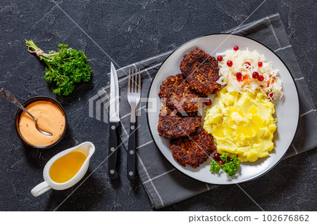 fried minced liver patties with potato mash fried minced liver patties with potato mash 102676862