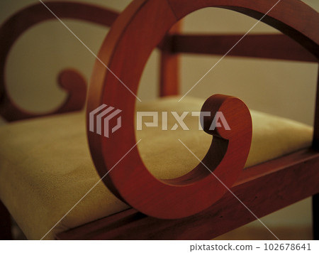 Close-up of the Garbo chair by Italian company Porada with soft light coming through the blinds Close-up of the Garbo chair by Italian company Porada with soft light coming through the blinds 102678641