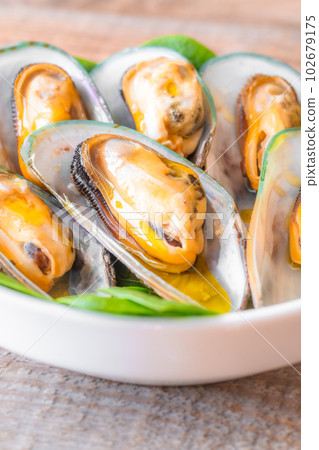 Baked half shell mussels Baked half shell mussels 102679175