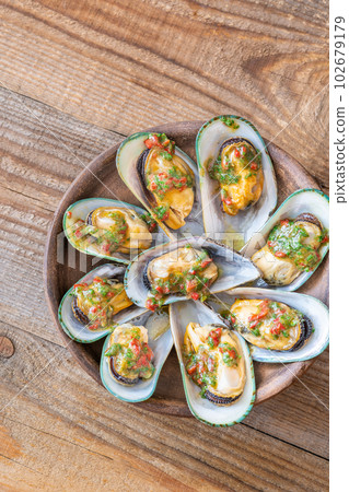 Baked half shell mussels Baked half shell mussels 102679179