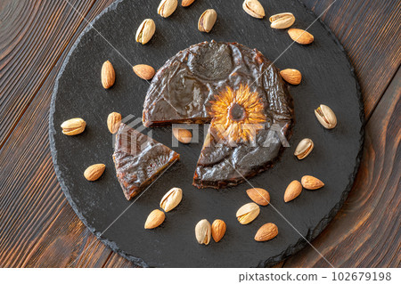 Pressed fruit and nut cake Pressed fruit and nut cake 102679198