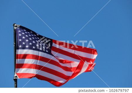 USA flag streaming in wind USA flag streaming in wind 102679797