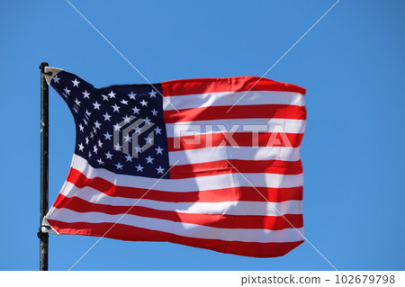 USA flag streaming in wind USA flag streaming in wind 102679798