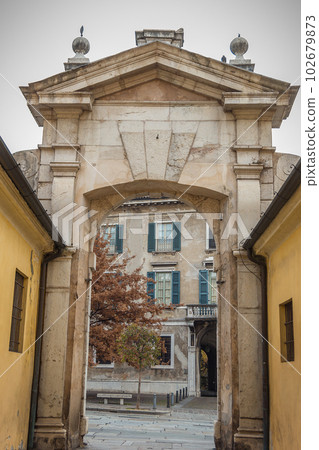 Ancient arch between the Broletto palace and the Martiri di Belfiore square Ancient arch between the Broletto palace and the Martiri di Belfiore square 102679873