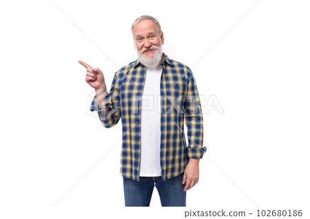 mature gray-haired retired man with a mustache and beard shows a hand gesture for having an idea on mature gray-haired retired man with a mustache and beard shows a hand gesture for having an idea on 102680186