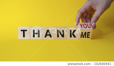 Thank You or Me symbol. Businessman Hand turns cubes and changes words Thank Me to thank you. Beautiful yellow background. Business and Thanks concept. Copy space Thank You or Me symbol. Businessman Hand turns cubes and changes words Thank Me to thank you. Beautiful yellow background. Business and Thanks concept. Copy space 102680481