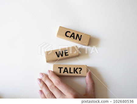 Can we talk symbol. Concept word Can we talk on wooden blocks. Businessman hand. Beautiful white background. Business and Can we talk concept. Copy space 102680536