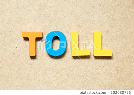 Color alphabet letter in word toll on wood background Color alphabet letter in word toll on wood background 102680756