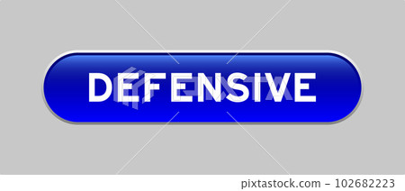 Blue color capsule shape button with word defensive on gray background 102682223