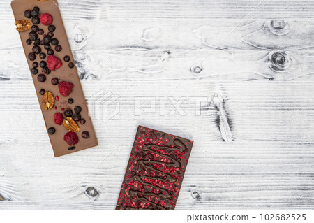 still life of chocolate with different kind dried fruit still life of chocolate with different kind dried fruit 102682525