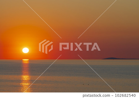 Summer sunset over the sea Summer sunset over the sea 102682540