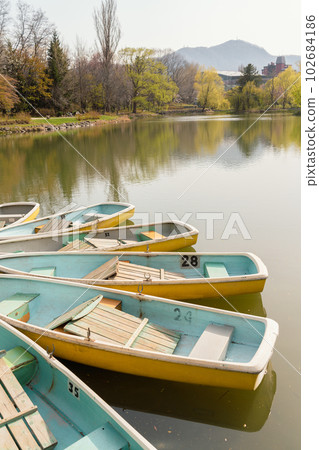 Nakajima park pond and boat in Sapporo, Hokkaido, Japan 102684186