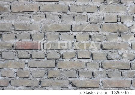 red brick laying, wall of an old building, brick background. red brick laying, wall of an old building, brick background. 102684653