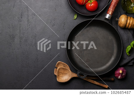 Top-down view of a kitchen table with ingredients, utensils, and copy space 102685487