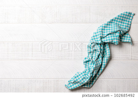 Top-down view of a kitchen table with a towel or napkin 102685492