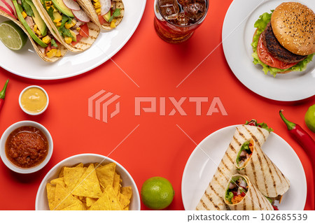 Mexican food featuring tacos, burritos, nachos, burgers Mexican food featuring tacos, burritos, nachos, burgers 102685539