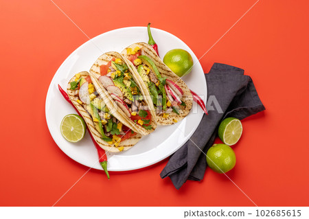 Mexican food featuring tacos Mexican food featuring tacos 102685615