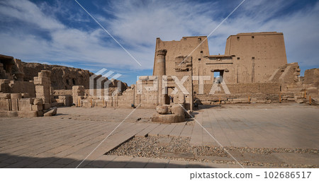 Temple of Edfu , Edfu, Egypt daylight view with clouds in the sky Temple of Edfu , Edfu, Egypt daylight view with clouds in the sky 102686517