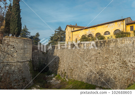 View on the castle of the city of Brescia on a sunny winter day 102688603