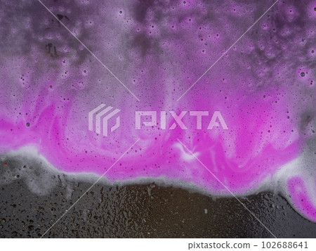 Beautiful pink and magenta soap background with waves and foam Beautiful pink and magenta soap background with waves and foam 102688641