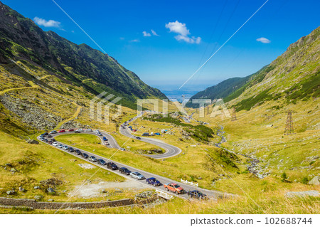 Summer sunday traffic jam on the mountain road Transfagarasan Summer sunday traffic jam on the mountain road Transfagarasan 102688744