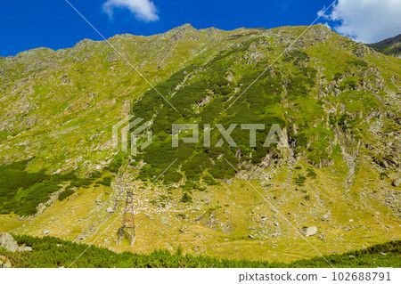 Romanian Carpathian mountains on a summer sunny day Romanian Carpathian mountains on a summer sunny day 102688791