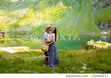 A beautiful couple hugging near of Lake Balea 102689251