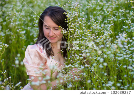 Portrait of a girl in white wildflowers Portrait of a girl in white wildflowers 102689287