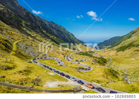 Summer sunday traffic jam on the mountain road Transfagarasan Summer sunday traffic jam on the mountain road Transfagarasan 102689803