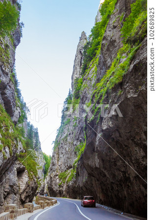 Dangerous road through the Bicaz Gorge in Romania Dangerous road through the Bicaz Gorge in Romania 102689825