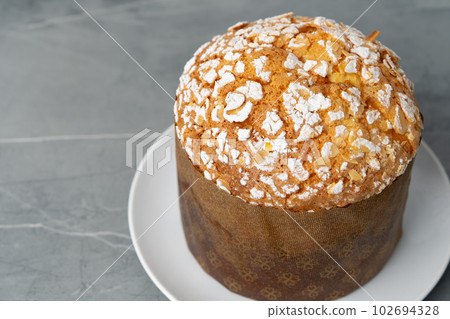 Easter cake with sugar powder on gray background 102694328