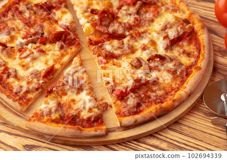 Freshly baked pizza on table close up 102694339