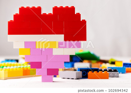 Heart shaped toy constructor details on white background 102694342
