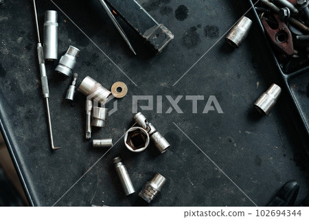 Different tools on workbench in car service Different tools on workbench in car service 102694344